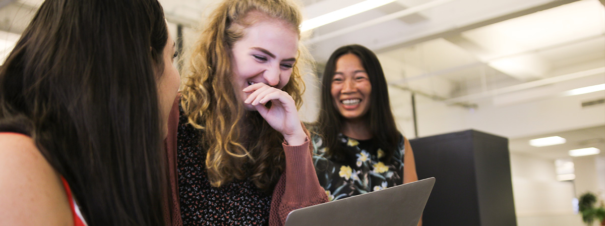 Colleagues laughing together
