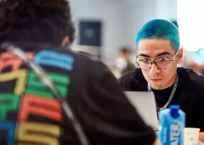 Bright haired employee working on laptop